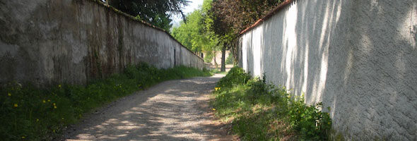 Through the alley between two estates on the trail from Lyon to Le Puy-en-Velay, France 2009